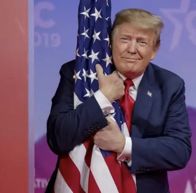 trump_2019-cpac_flag-hug_SQUARE