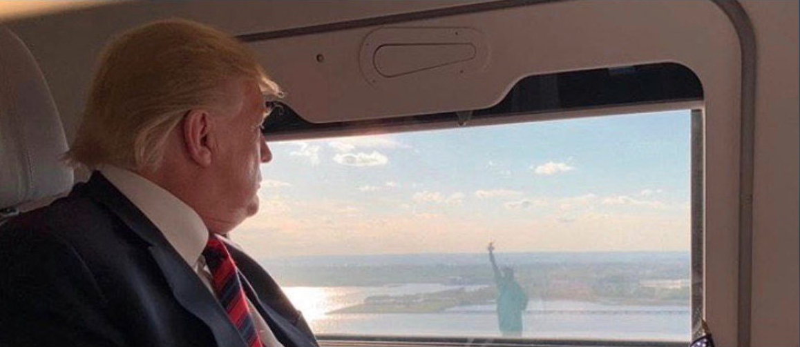 TRUMP-plane-window-statue-of-liberty