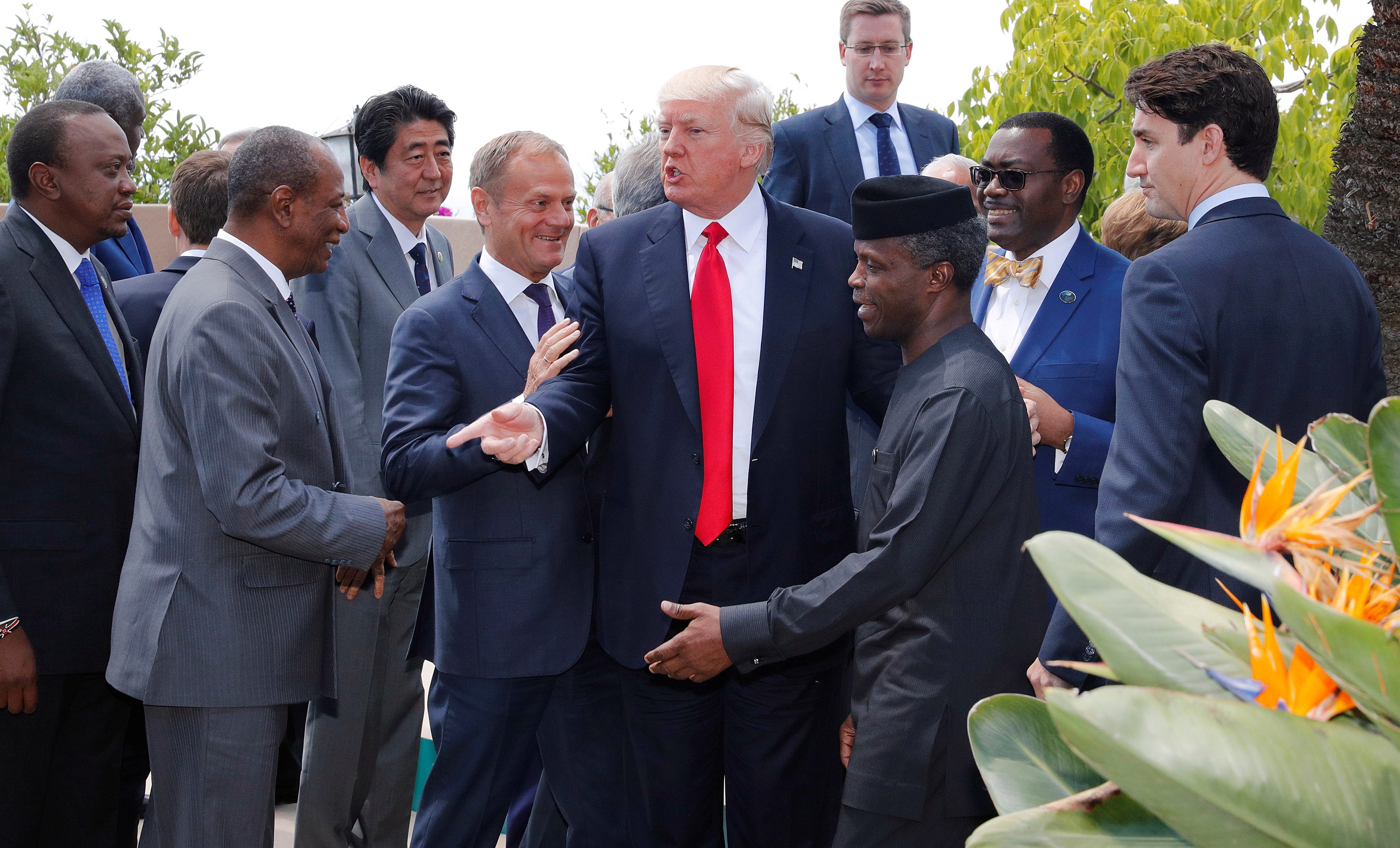 U.S. President Donald Trump poses with African leaders after the family photo at the end of the expanded session at the G7 Summit in Taormina